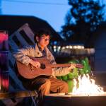 Izz Rayan, as Romeo in Southridge Senior School&rsquo;s Romeo and Juliet, plays guitar by the firepit at Alex House, location for the the immersive, 
interactive production. (Tyler Garnham Photography/Contributed to Peace Arch News)